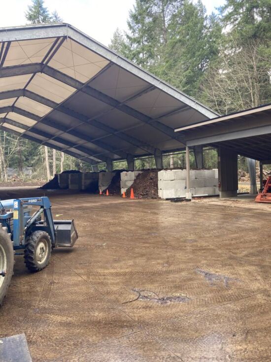 North facing view of compost facility. Both ASP bin in use with cones in front marking perforated PVC pipes. North facing view of compost facility.